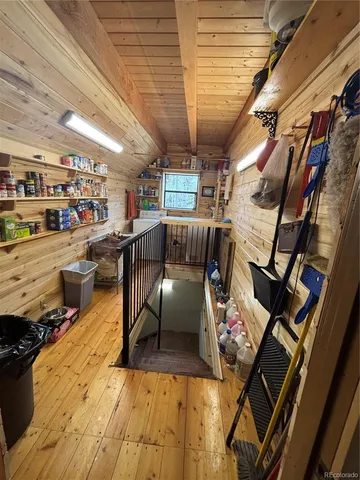 a bathroom with a sink a toilet a mirror and shower