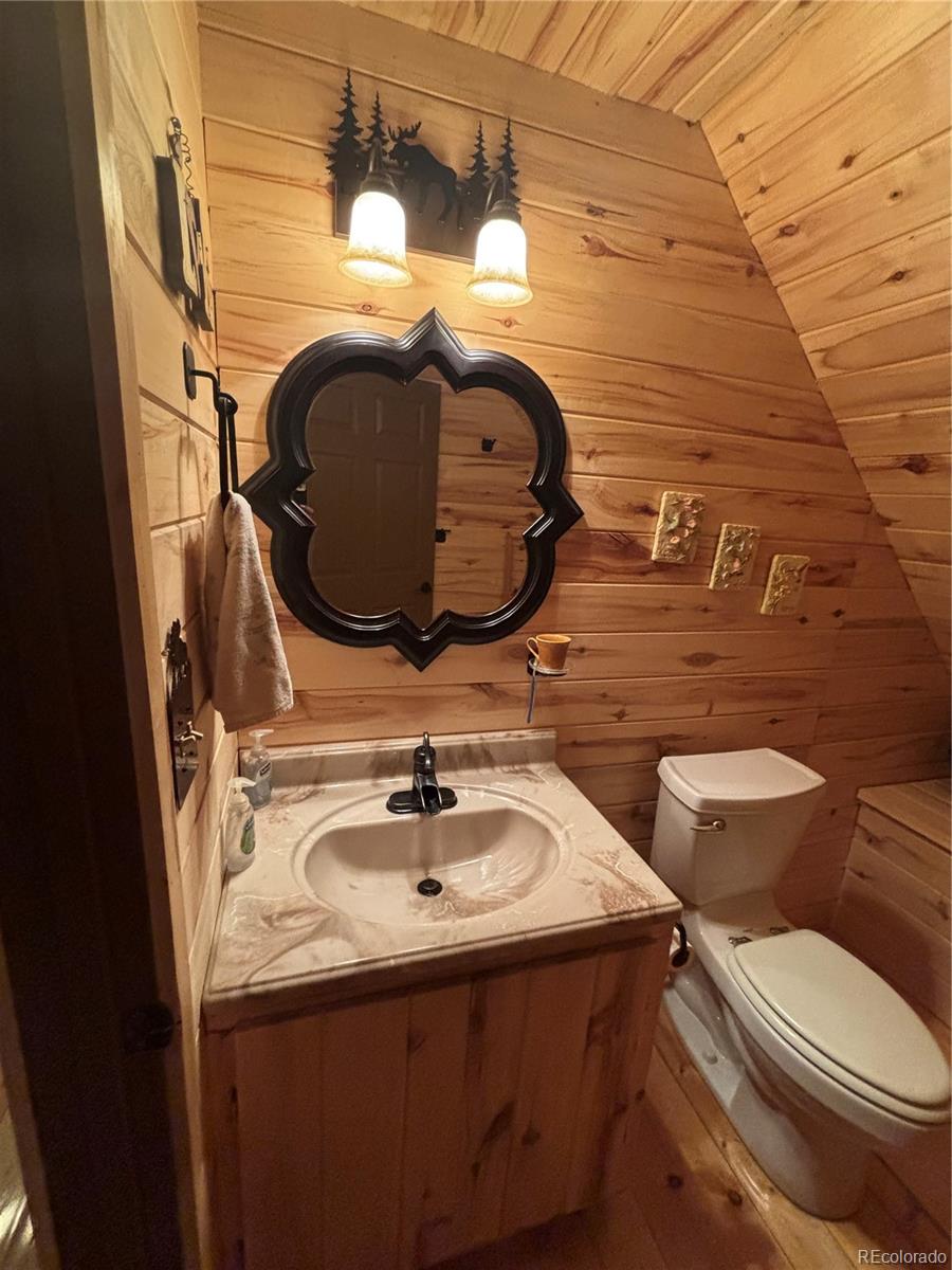 1113 Spring Street Del Norte, CO 81132 - Photo 36 of 45 a bathroom with a sink and mirror