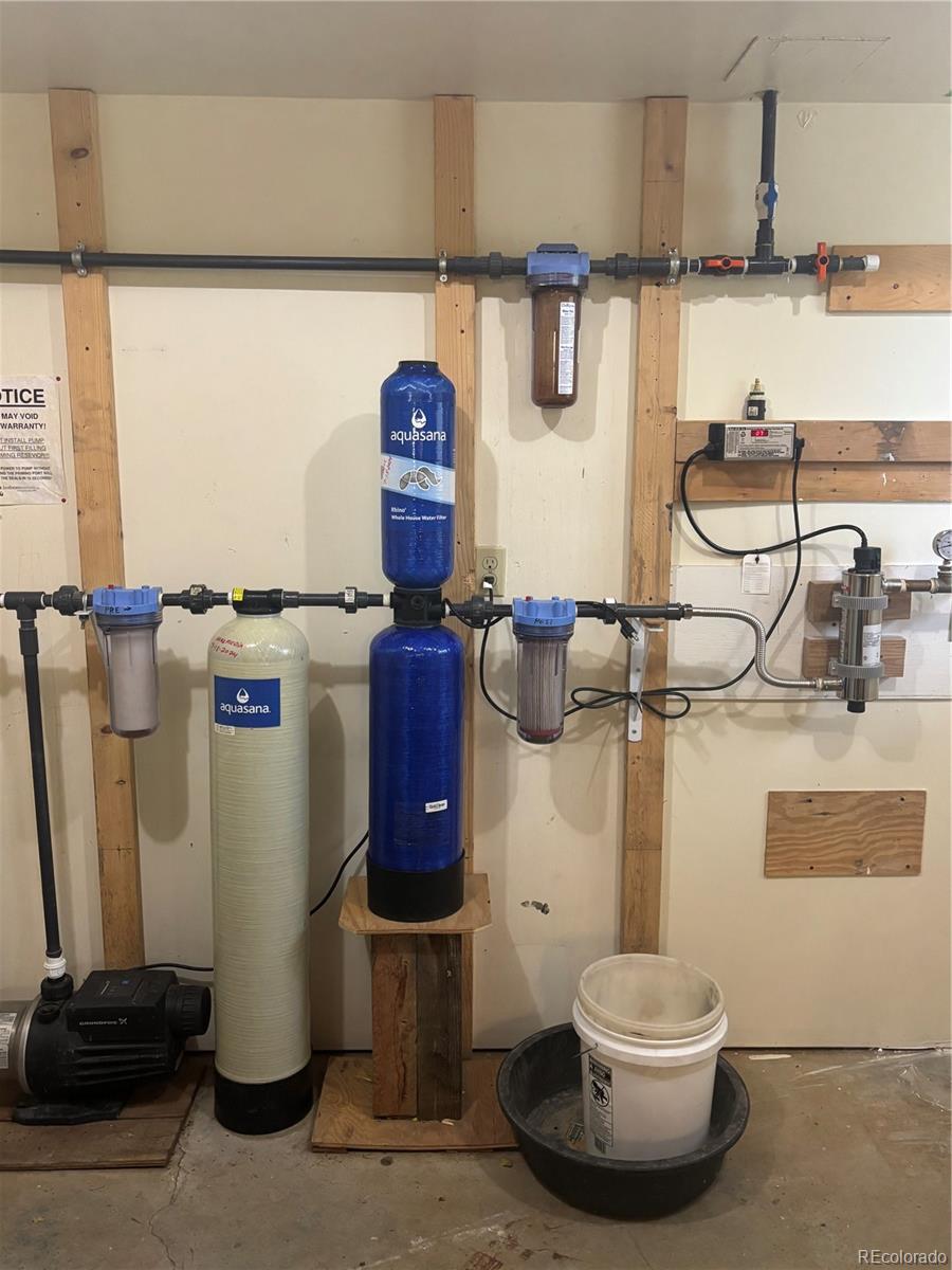 1113 Spring Street Del Norte, CO 81132 - Photo 43 of 45 a bathroom with a sink and a washing machine