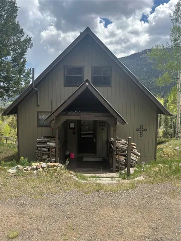 a backyard of a house with lots of green space and plants