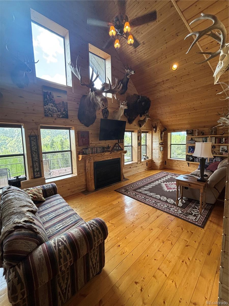 1113 Spring Street Del Norte, CO 81132 - Photo 9 of 45 a spacious bedroom with a bed dresser and a large window