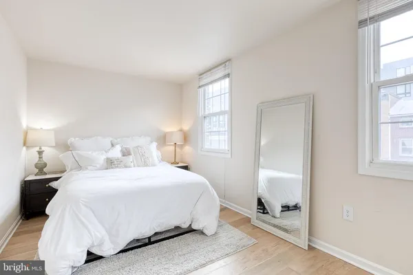 a bedroom with a bed and a window