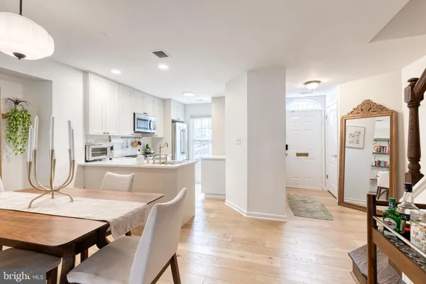 a view of a dining room with furniture and a wooden floor