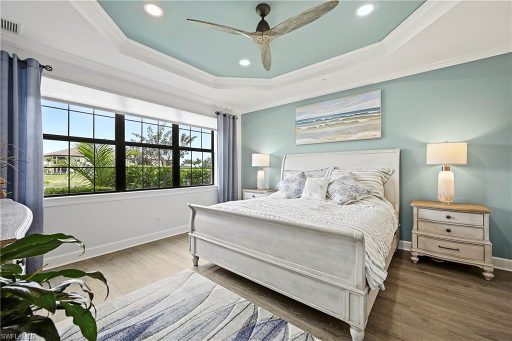 15245 Zeno Way, Unit 101 Naples, FL 34114 - Photo 15 of 46 a bedroom with a bed and a window