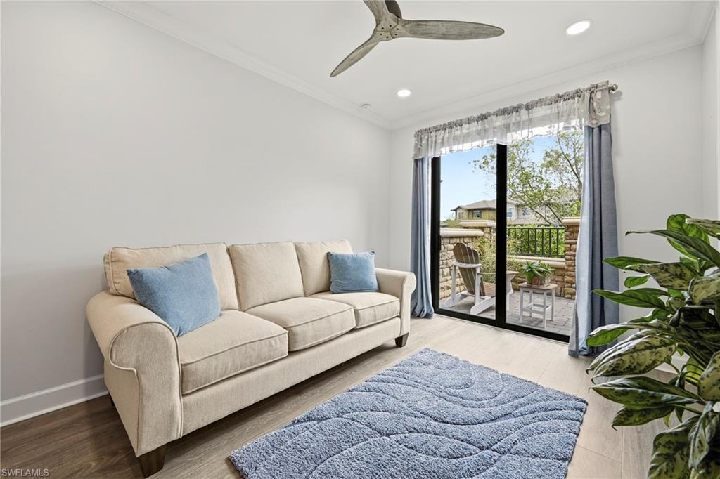 15245 Zeno Way, Unit 101 Naples, FL 34114 - Photo 20 of 46 a living room with furniture and a potted plant