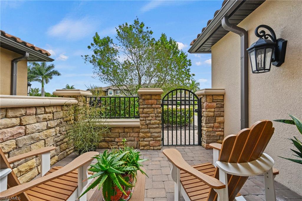 15245 Zeno Way, Unit 101 Naples, FL 34114 - Photo 21 of 46 a view of a chair and table in the balcony