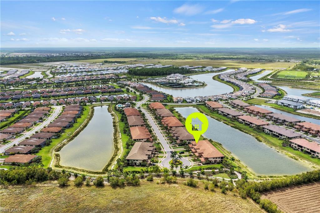 15245 Zeno Way, Unit 101 Naples, FL 34114 - Photo 34 of 46 an aerial view of residential houses with outdoor space