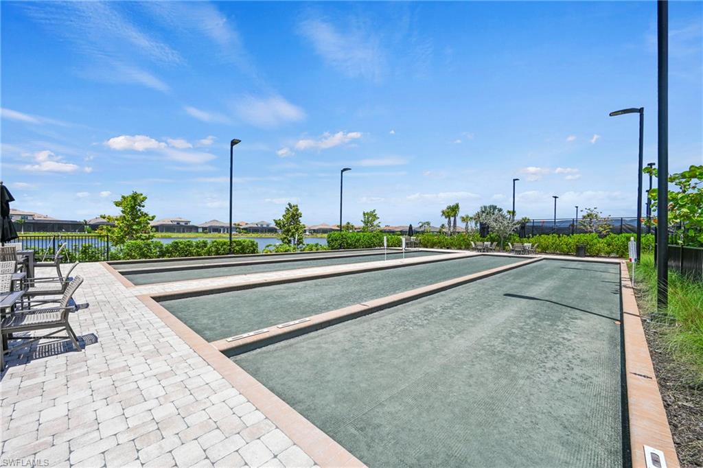 15245 Zeno Way, Unit 101 Naples, FL 34114 - Photo 39 of 46 a view of a swimming pool with a terrace