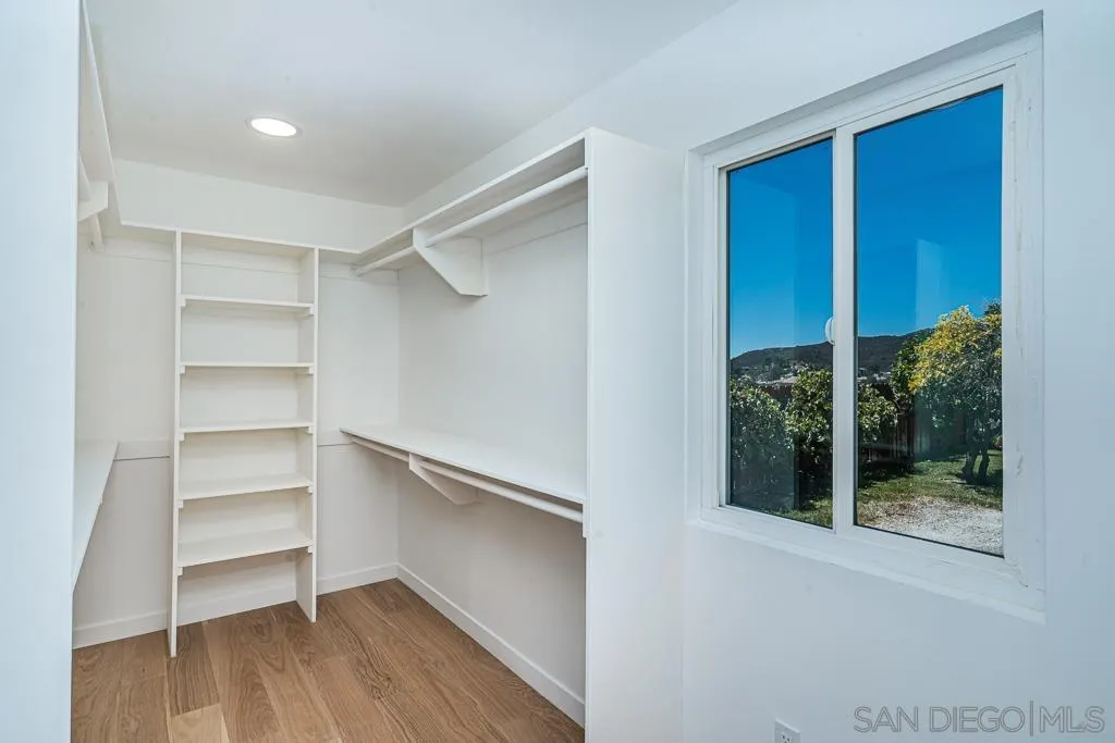 12710 McFeron Road Poway, CA 92064 - Photo 17 of 35 a view of walk in closet with empty racks