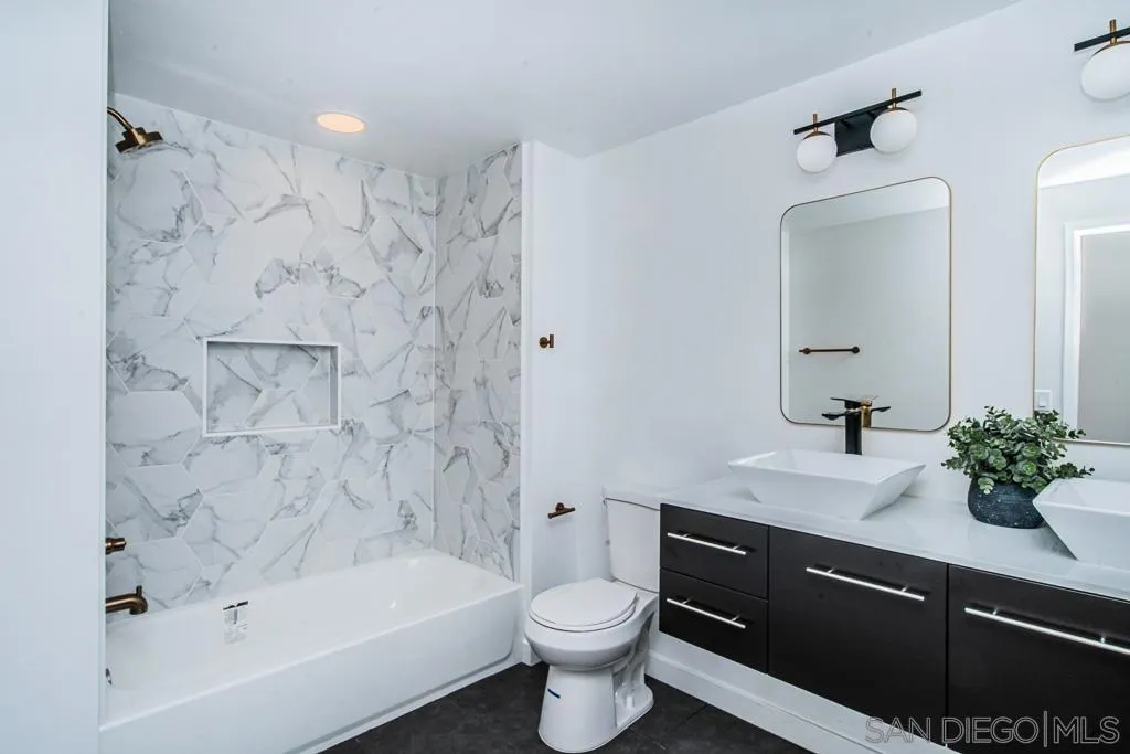 12710 McFeron Road Poway, CA 92064 - Photo 18 of 35 a bathroom with a sink a toilet and bathtub