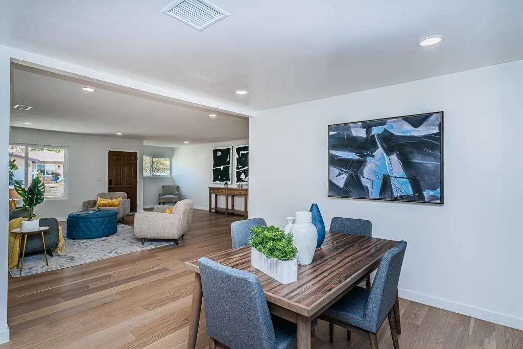 12710 McFeron Road Poway, CA 92064 - Photo 26 of 35 a view of a dining room with furniture wooden floor and a potted plant