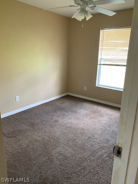 3206 51st Street West Lehigh Acres, FL 33971 - Photo 12 of 20 an empty room with a window