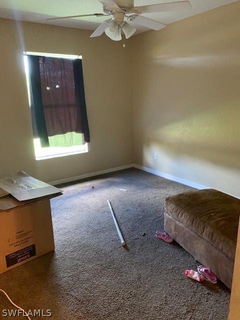 3206 51st Street West Lehigh Acres, FL 33971 - Photo 7 of 20 a living room with a couch and a window