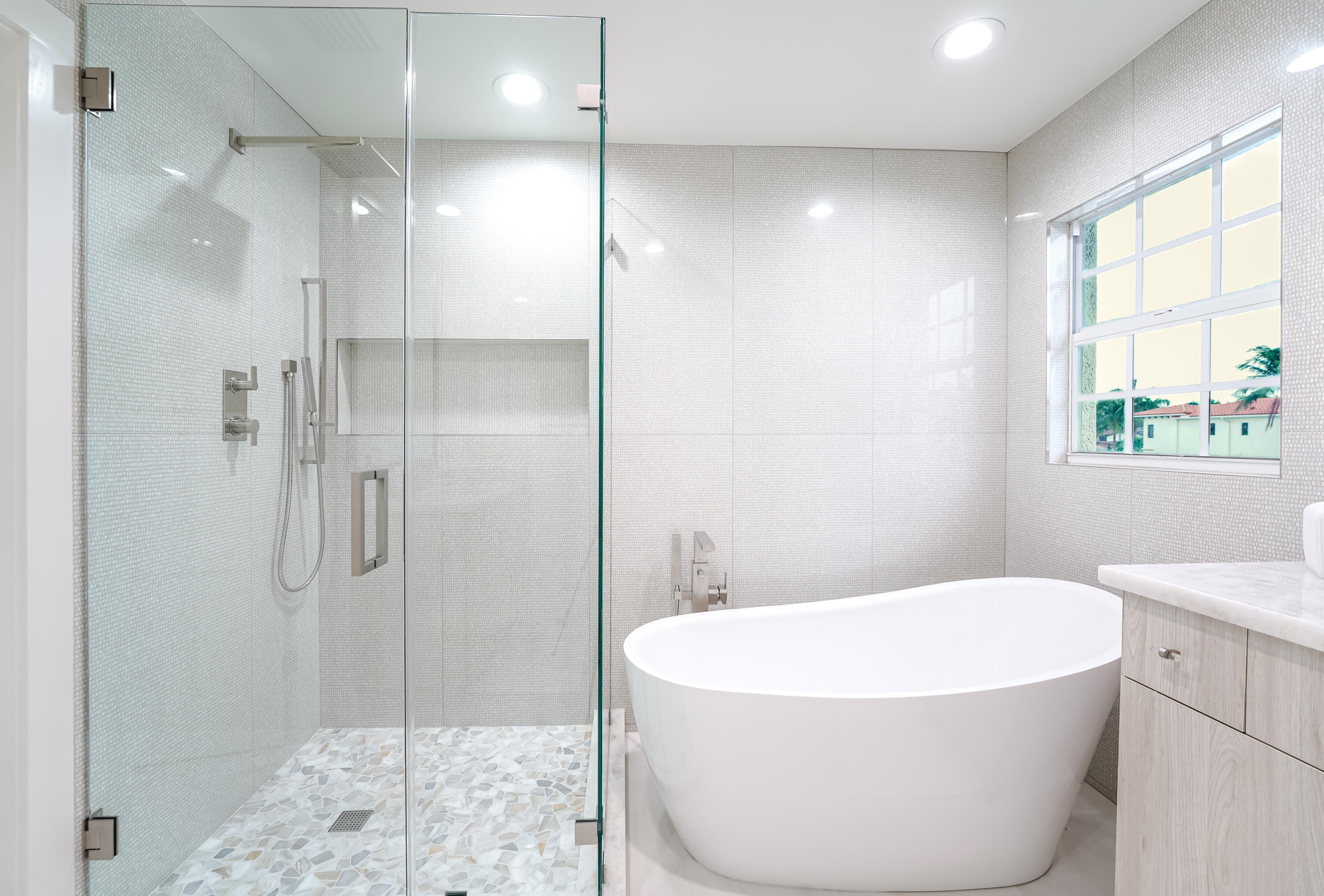 749 Northeast 71st Street Boca Raton, FL 33487 - Photo 36 of 43 a bathroom with a bathtub and a shower