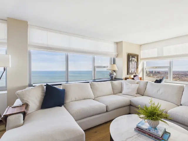 a view of a living room filled with furniture