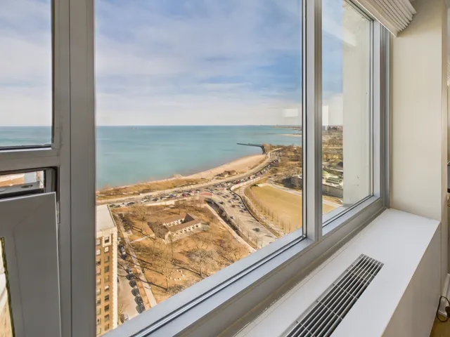 a kitchen with stainless steel appliances a refrigerator and a stove top oven