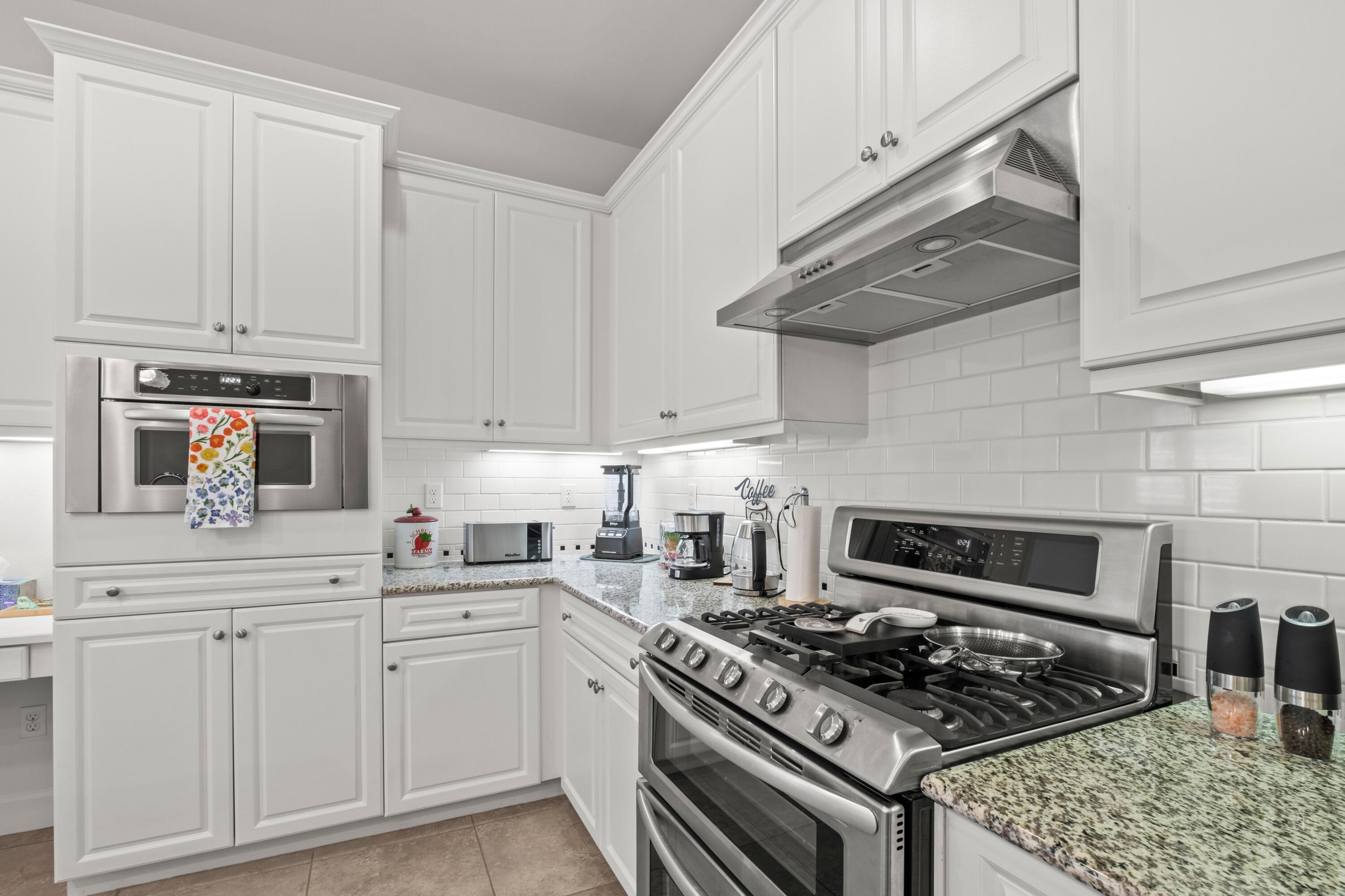 81360 Corte Compras Indio, CA 92203 - Photo 13 of 24 a kitchen with white cabinets and appliances