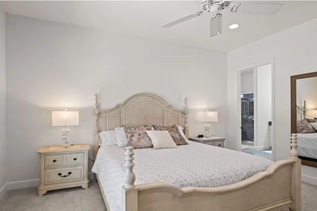 a bed room with a bed and a night stand