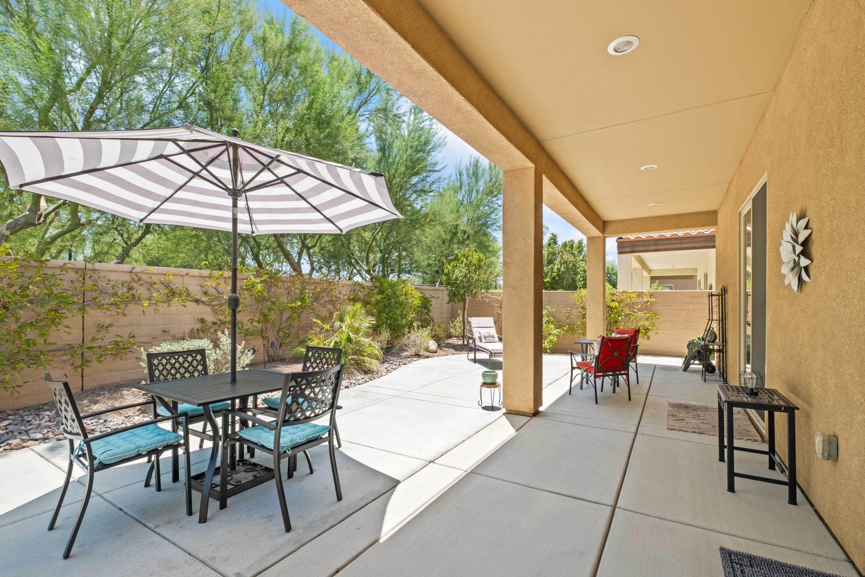 81360 Corte Compras Indio, CA 92203 - Photo 23 of 24 a view of patio with table and chairs under an umbrella