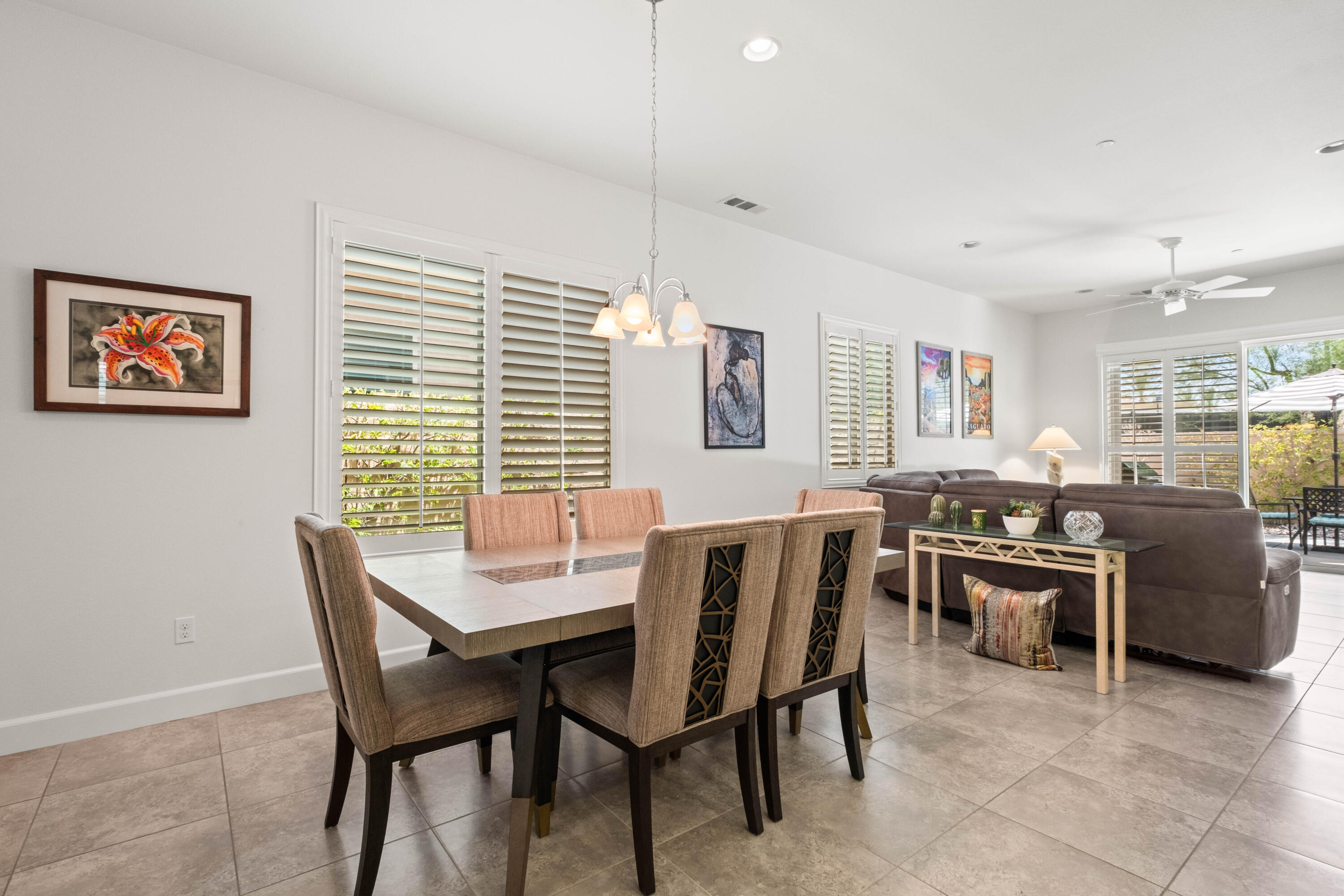 81360 Corte Compras Indio, CA 92203 - Photo 8 of 24 a dining room with a wooden table and chairs