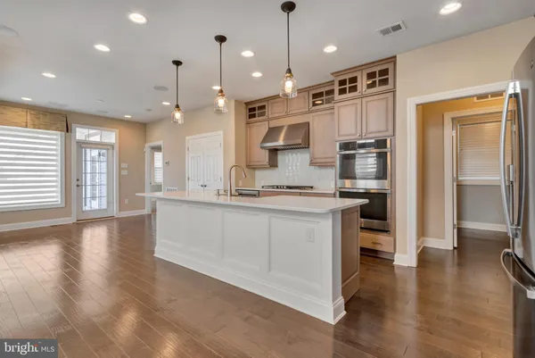 a kitchen with cabinets and appliances