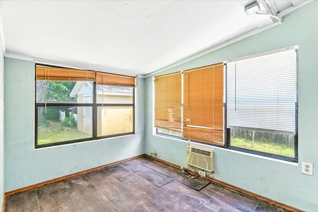 a view of an empty room with a window