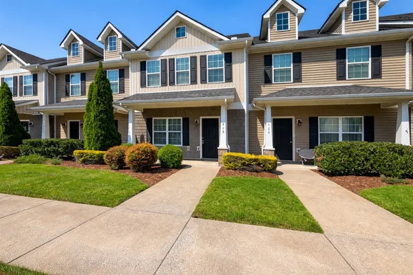 a front view of a house with yard