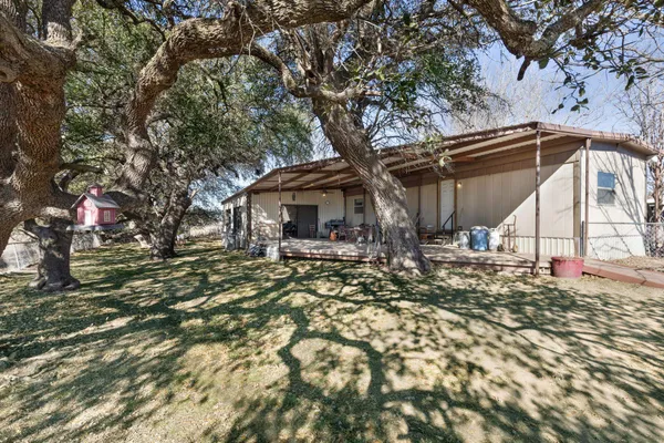 a view of house with a tree