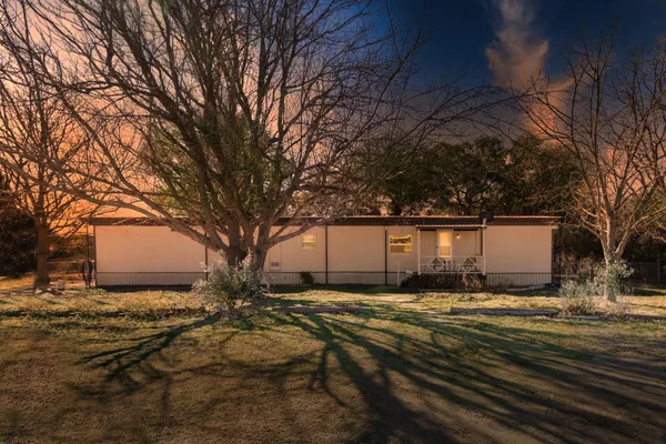 a view of house with yard