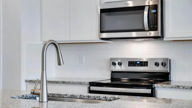 a living room with a fireplace and a flat screen tv
