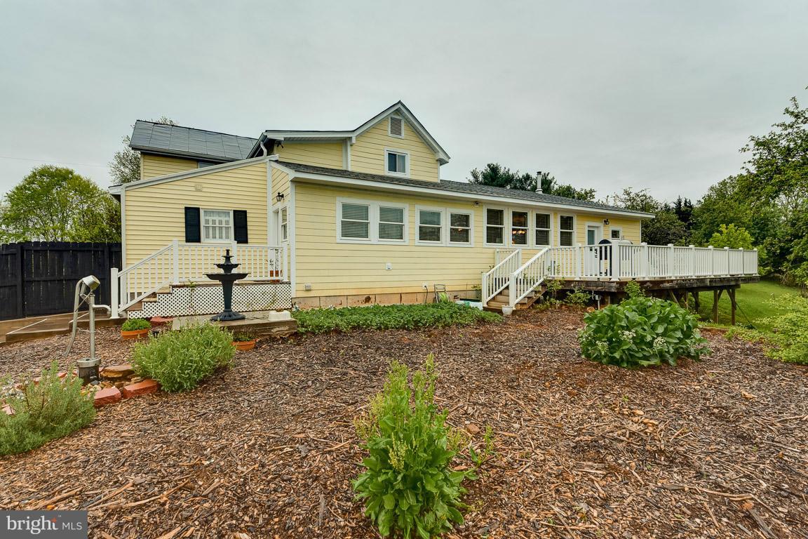 394 Hunters Road Washington, VA 22747 - Photo 26 of 30 Rear of home with deck and garden