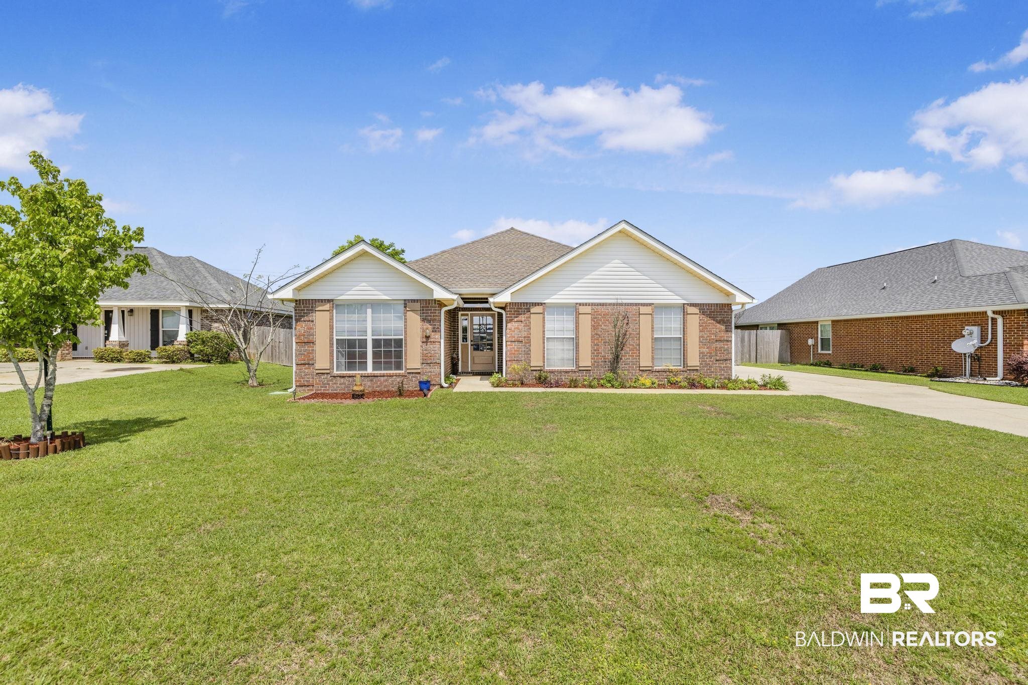 16545 Cold Mill Loop Foley, AL 36535 - Photo 1 of 48 Ranch-style home with brick siding, a front yard, driveway, and fence