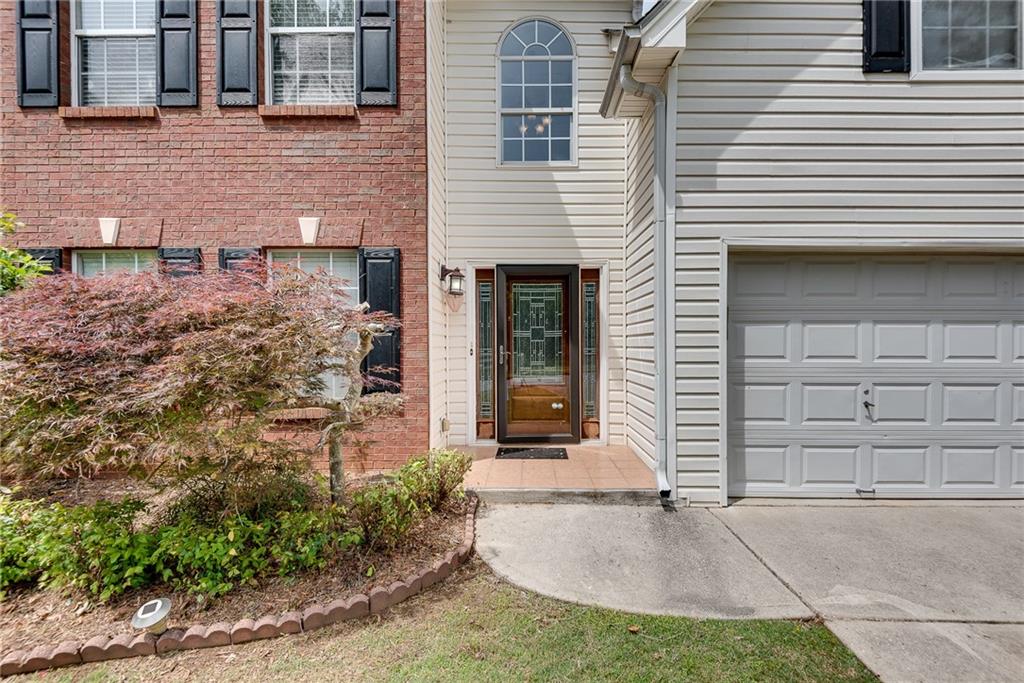 3337 Baymount Way Lawrenceville, GA 30043 - Photo 6 of 47 a front view of a house with a yard