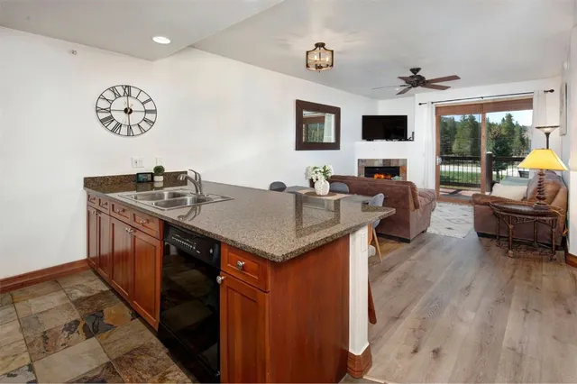 a kitchen with a stove a refrigerator and a dining table
