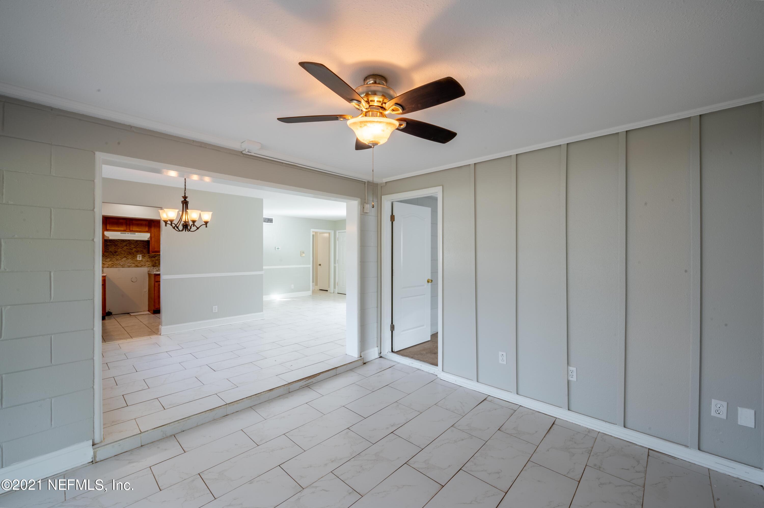 7521 Strato Road Jacksonville, FL 32210 - Photo 20 of 40 a view of an empty room and kitchen view