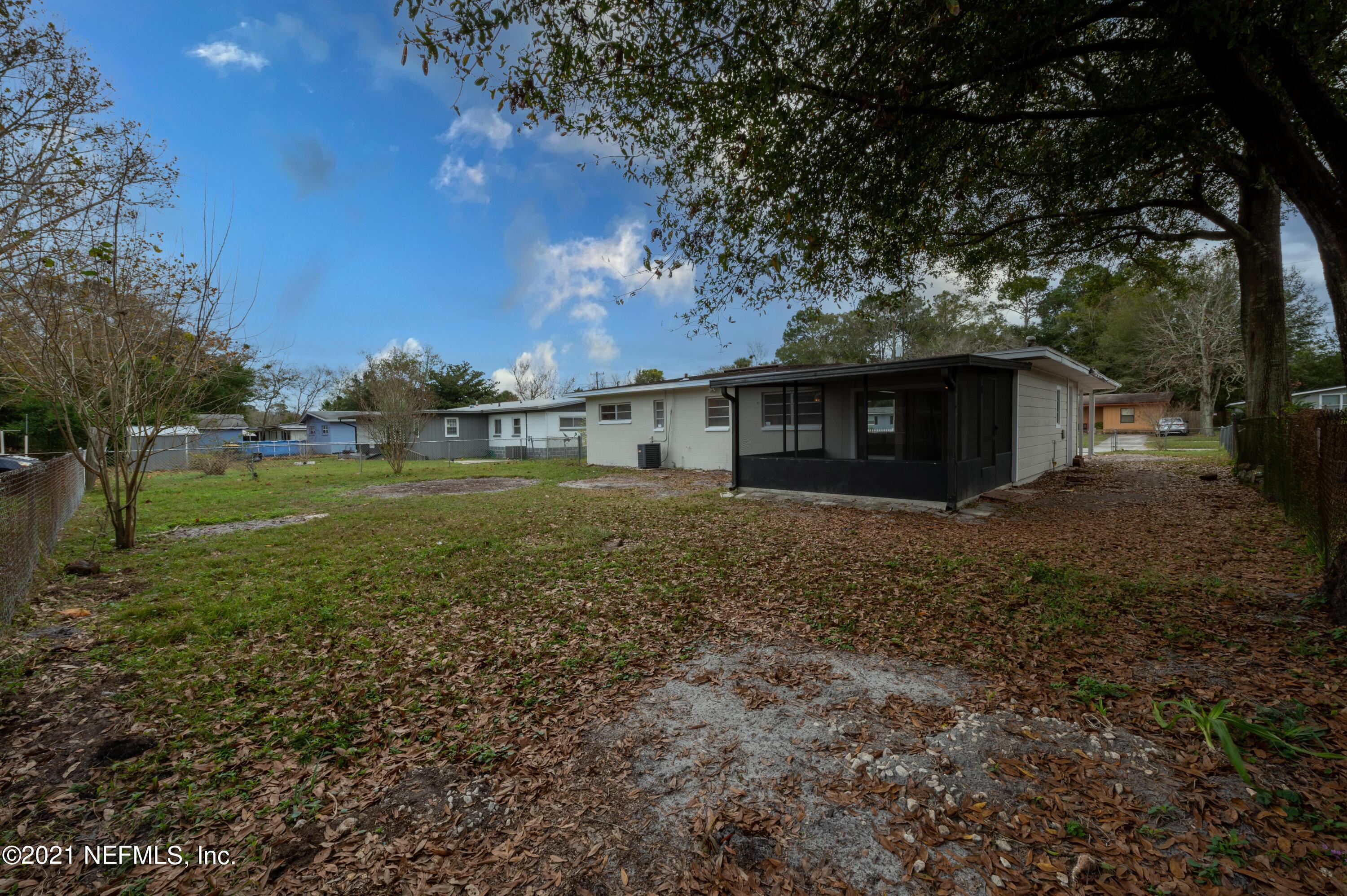 7521 Strato Road Jacksonville, FL 32210 - Photo 29 of 40 a view of a house with a yard