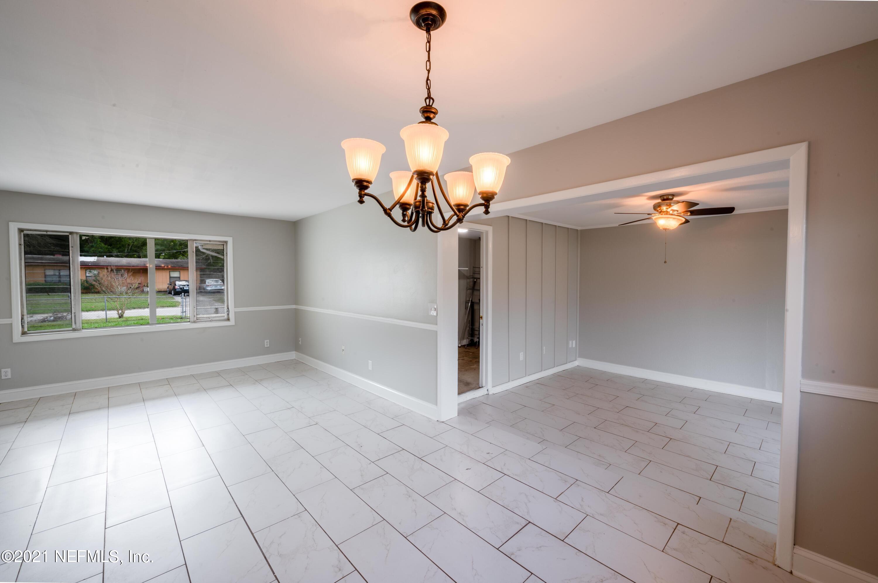 7521 Strato Road Jacksonville, FL 32210 - Photo 36 of 40 a view of an empty room with a chandelier fan