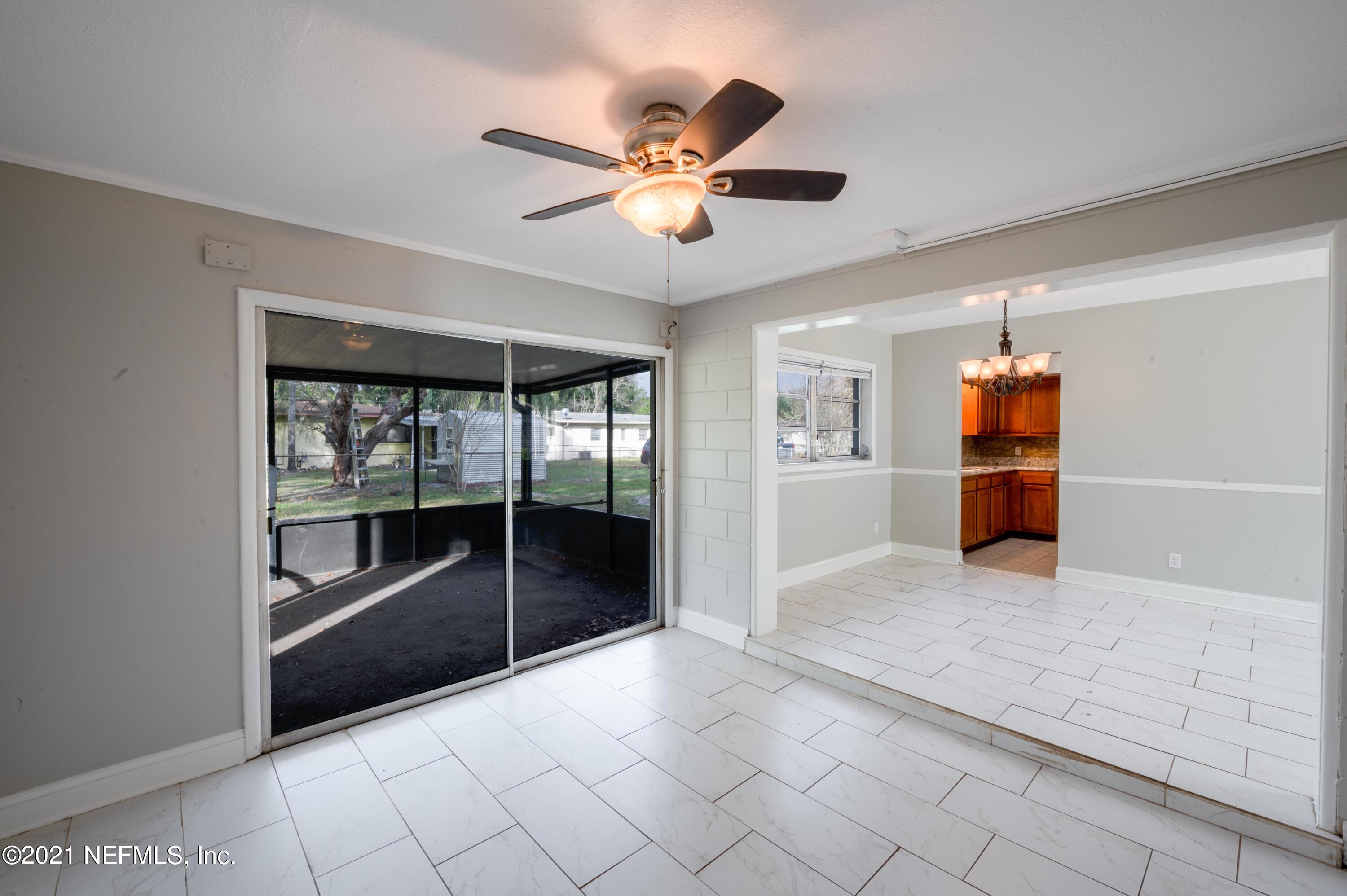 7521 Strato Road Jacksonville, FL 32210 - Photo 7 of 40 a view of a livingroom with a ceiling fan and window