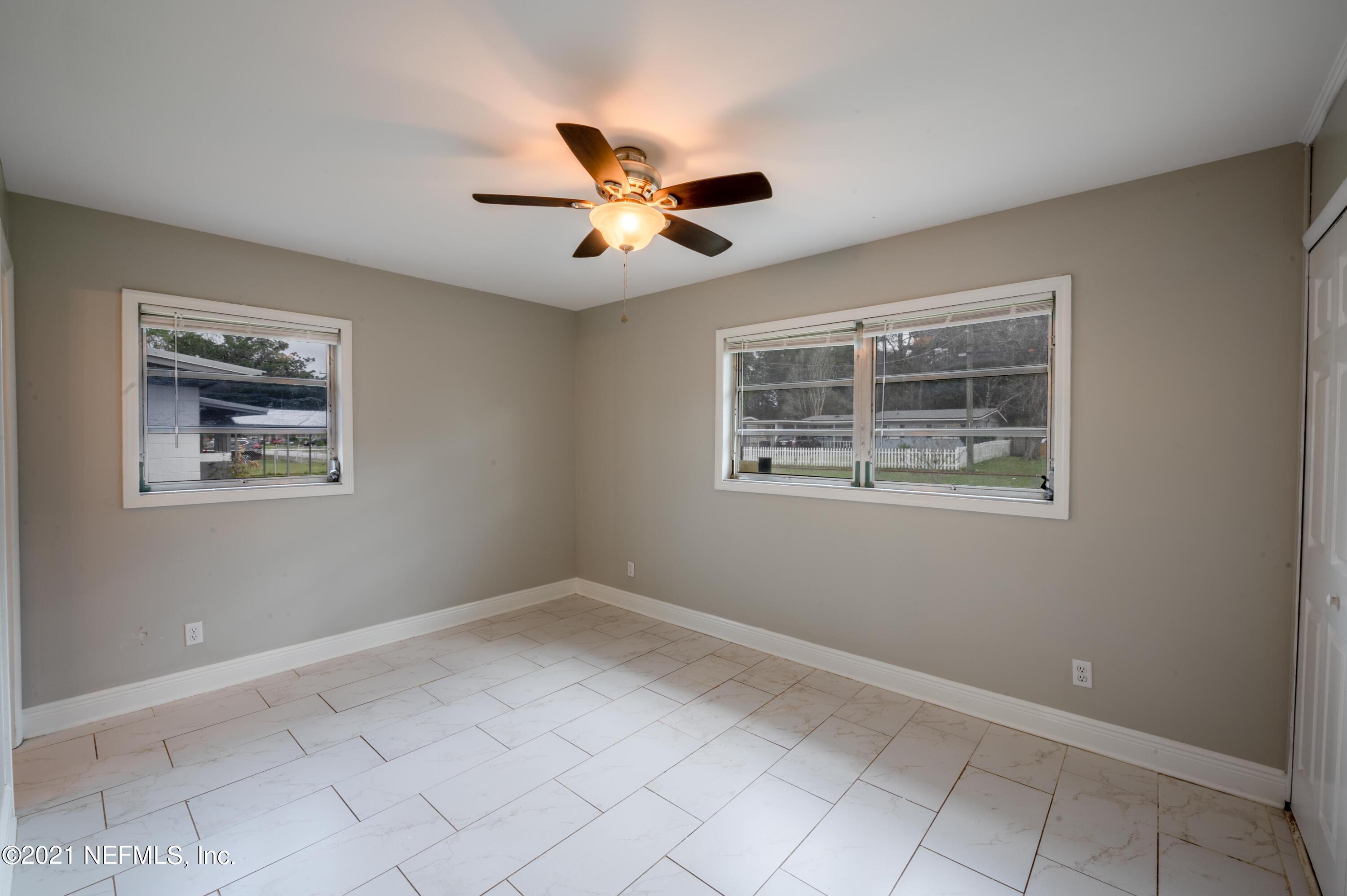 7521 Strato Road Jacksonville, FL 32210 - Photo 10 of 40 a view of an empty room with a window