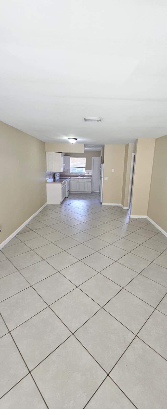 1202 Summer Street, Unit 3076 Palm Springs, FL 33461 - Photo 7 of 13 a view of kitchen and empty room