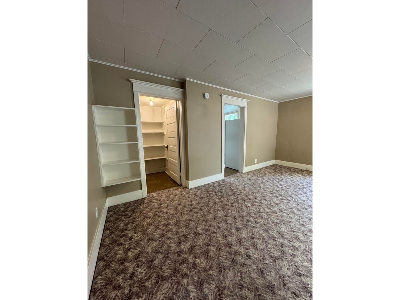516 South Meldrum Street Fort Collins, CO 80521 - Photo 12 of 15 a bedroom with a bed and a window