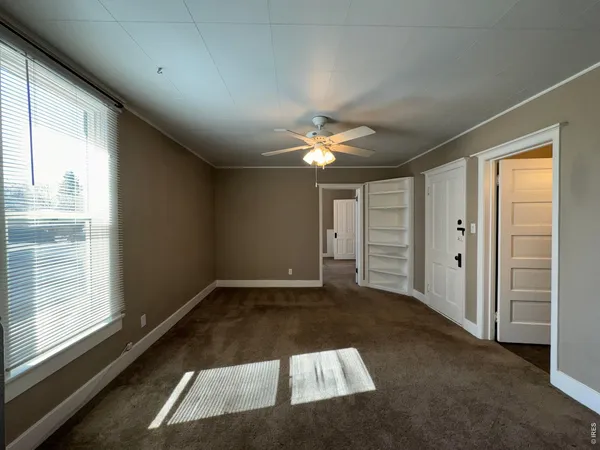 a view of an empty room and window