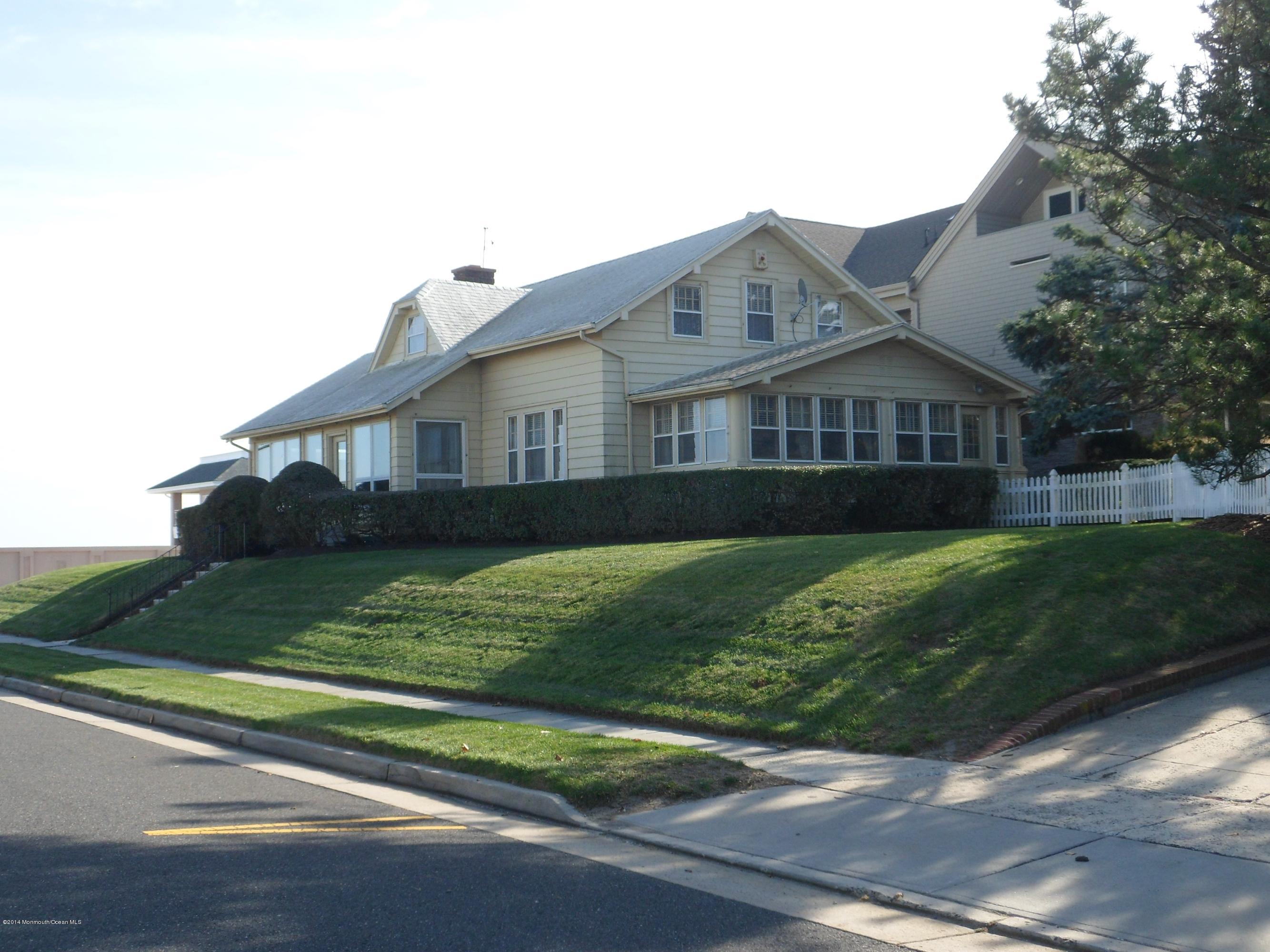 2011 North Ocean Avenue Spring Lake, NJ 07762 - Photo 5 of 6 a view of a house next to a big yard and large trees