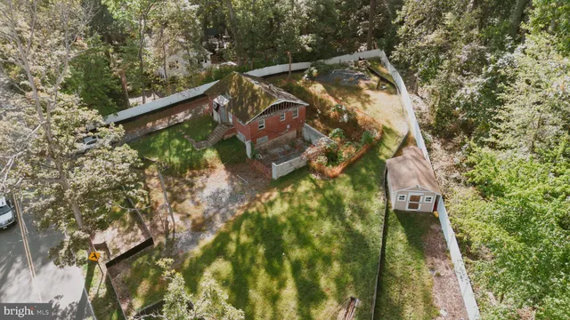 a backyard of a house with large trees