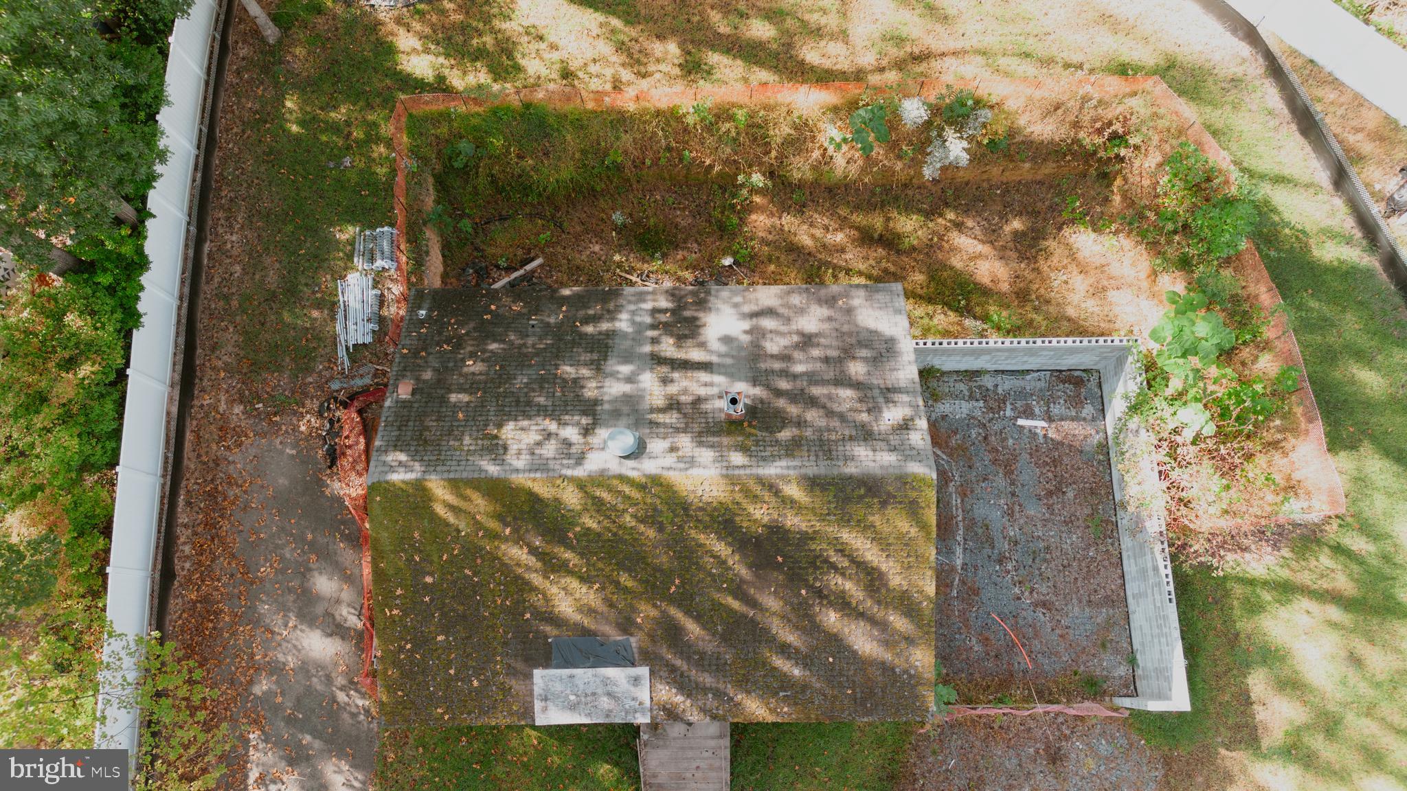 6649 Kerns Road Falls Church, VA 22042 - Photo 34 of 38 a backyard of a house with large trees