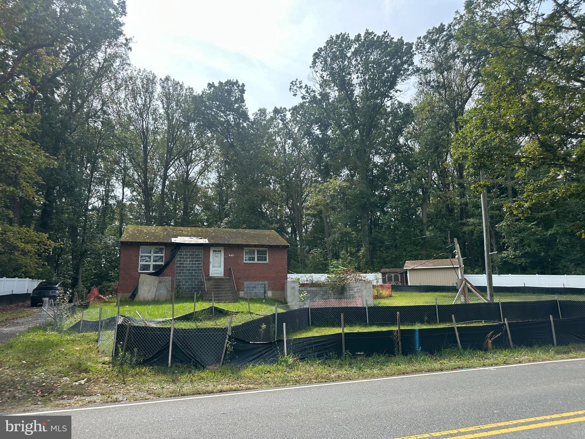 6649 Kerns Road Falls Church, VA 22042 - Photo 5 of 38 a front view of a house with a yard table and chairs
