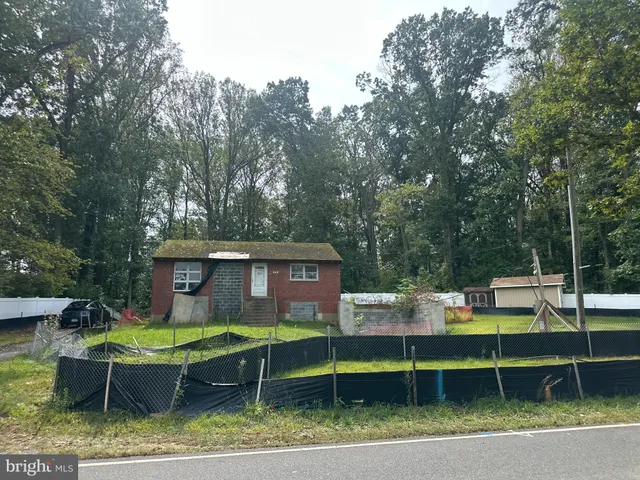 a view of a swimming pool with a lounge chair