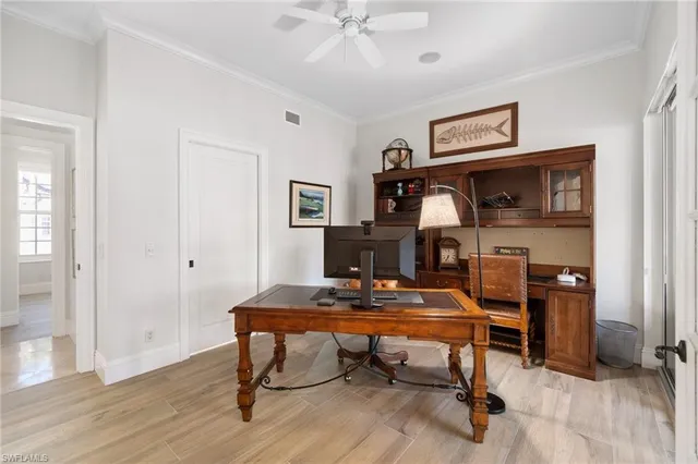 a utility room with granite countertop cabinets washer and dryer