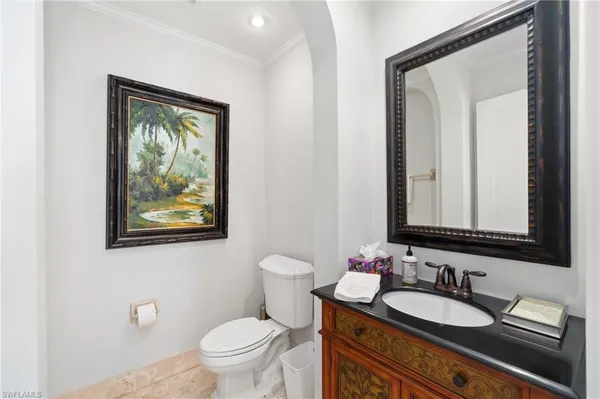 a view of a workspace with furniture and wooden floor