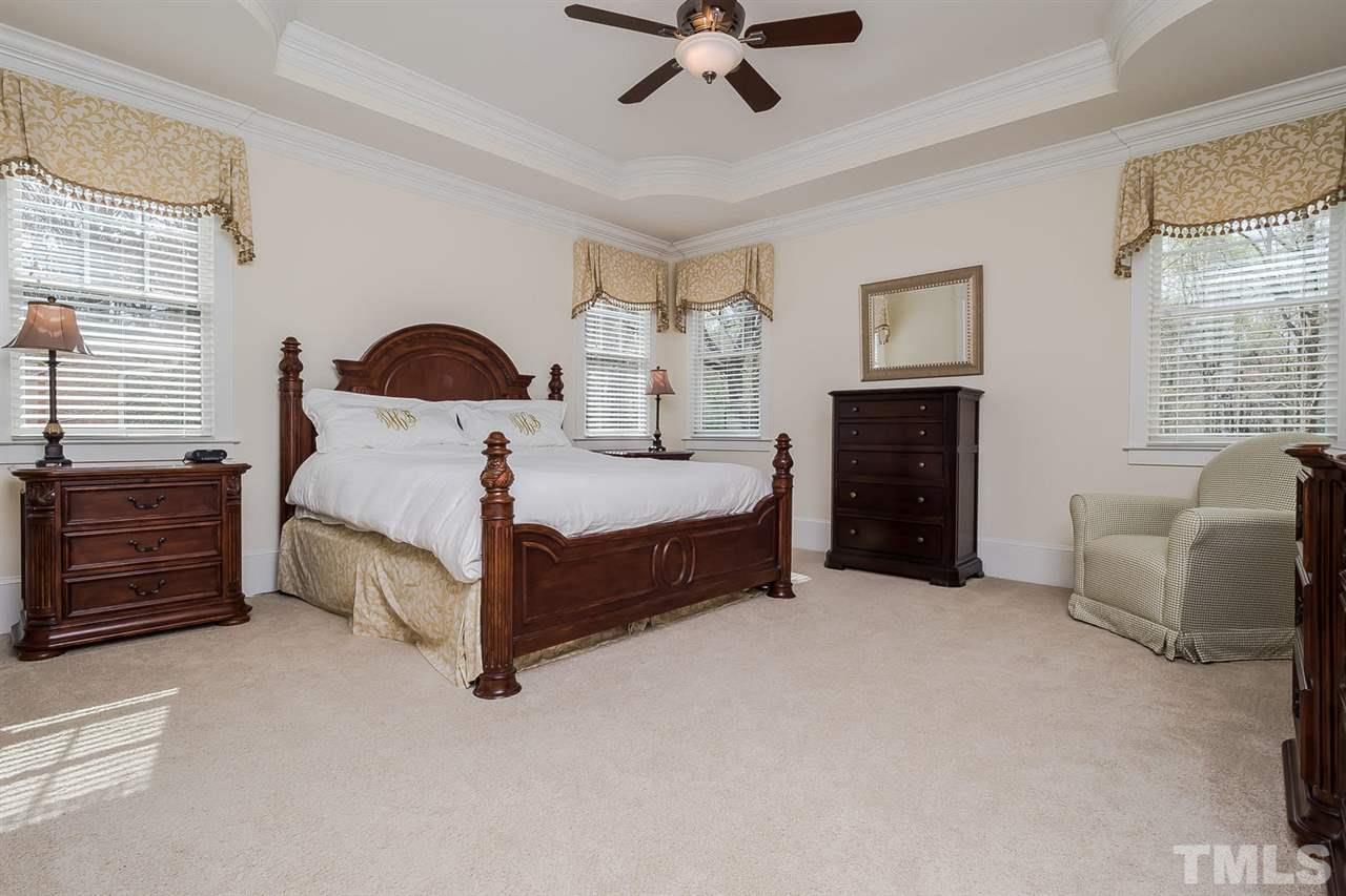 1101 Shelley Road Raleigh, NC 27609 - Photo 12 of 25 a bed room with a bed and a couch